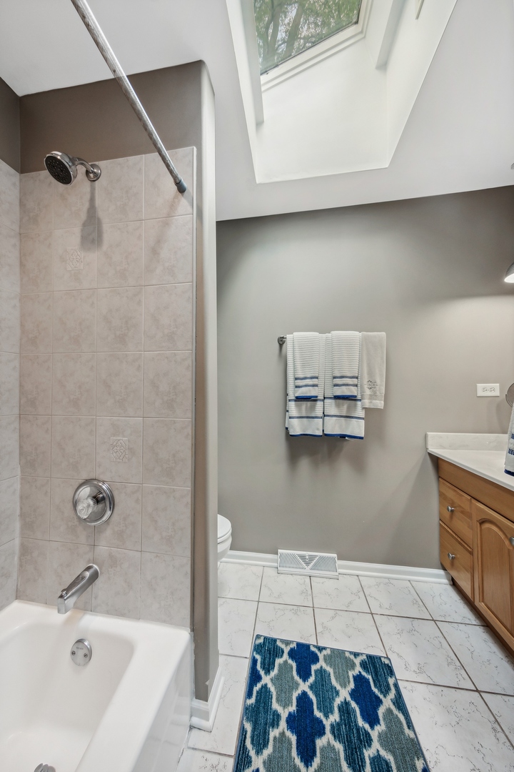 141 Hidden View Drive Westmont, IL 60559 - Photo 15 of 19 a bathroom with a sink and a bathtub