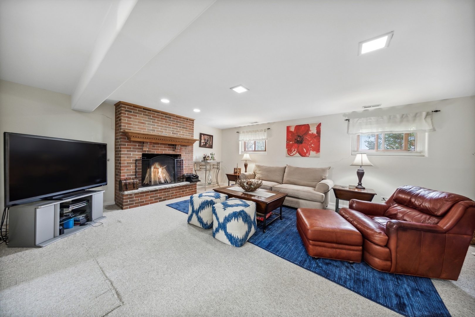 141 Hidden View Drive Westmont, IL 60559 - Photo 17 of 19 a living room with furniture a flat screen tv and a fireplace