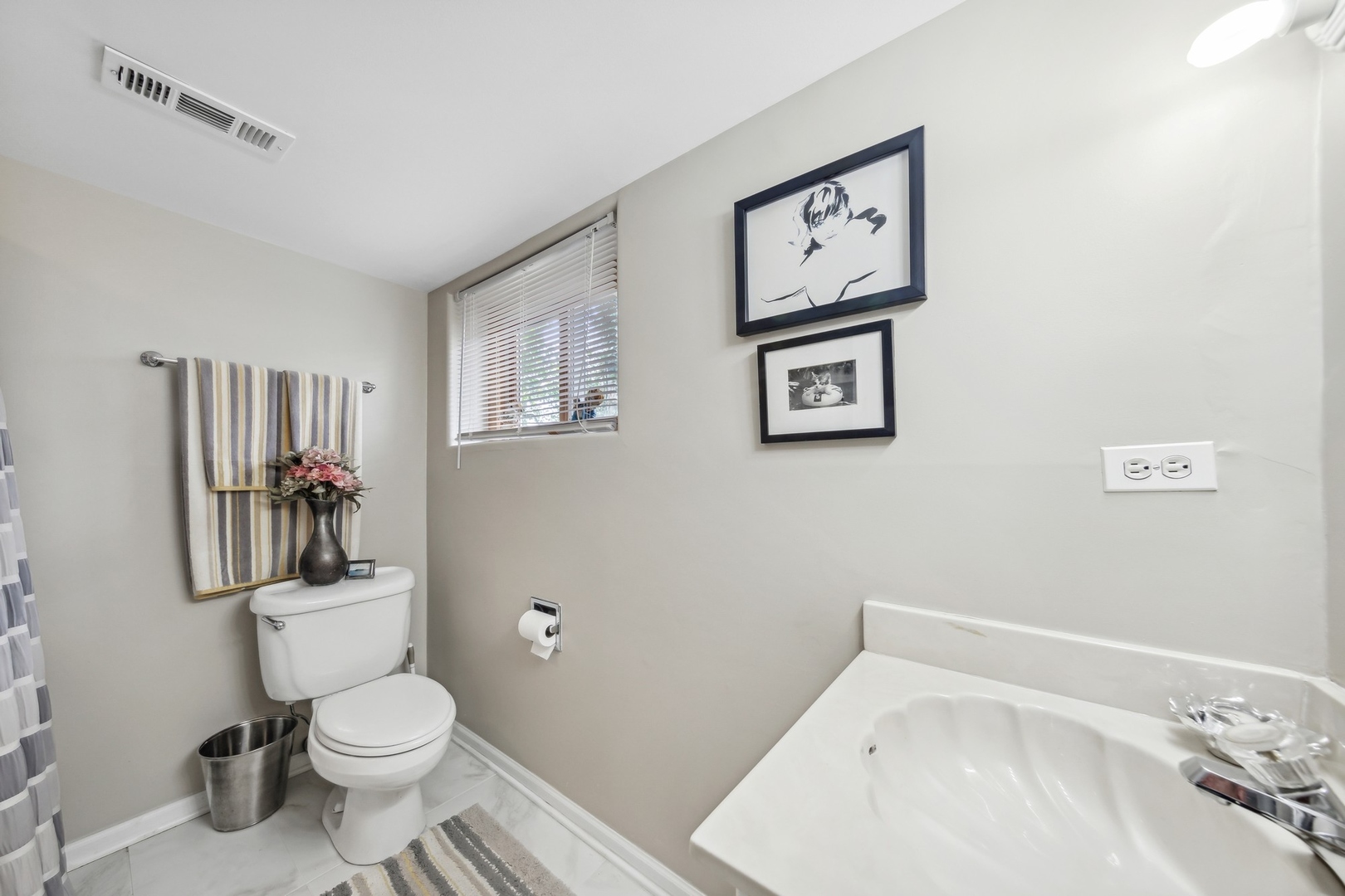 141 Hidden View Drive Westmont, IL 60559 - Photo 19 of 19 a white toilet sitting next to a bathroom sink