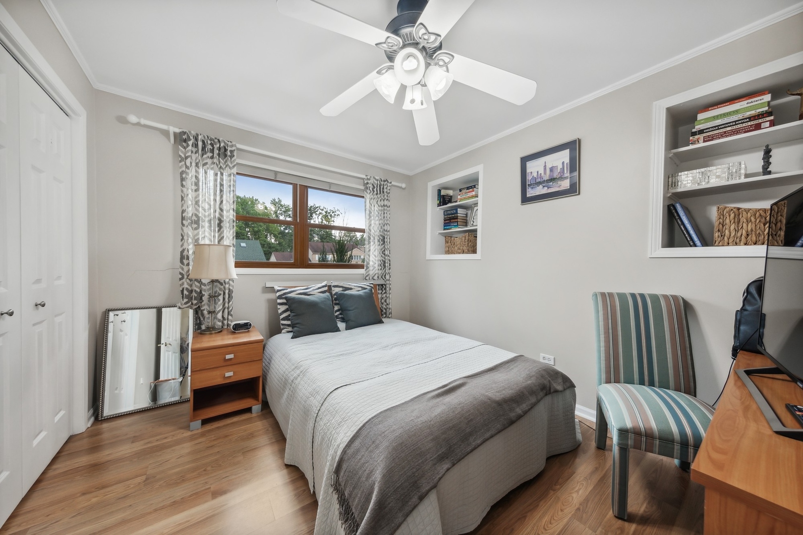 141 Hidden View Drive Westmont, IL 60559 - Photo 10 of 19 a bedroom with a bed and a chandelier