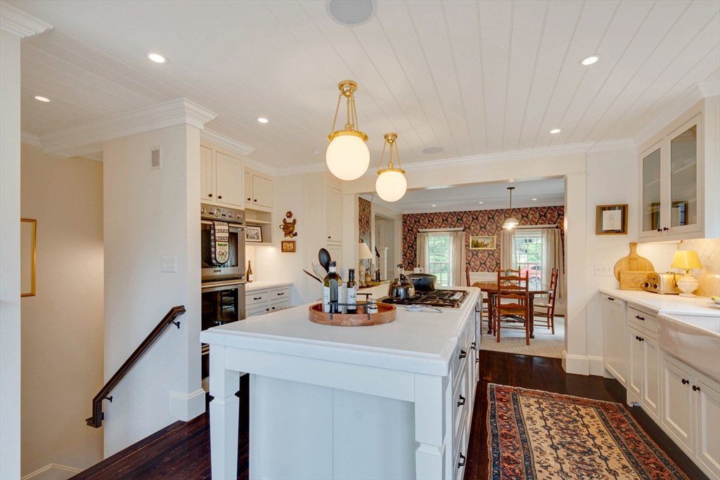 24 Cleveland Road Needham, MA 02492 - Photo 11 of 42 a view of a kitchen counter space a sink stainless steel appliances and cabinets