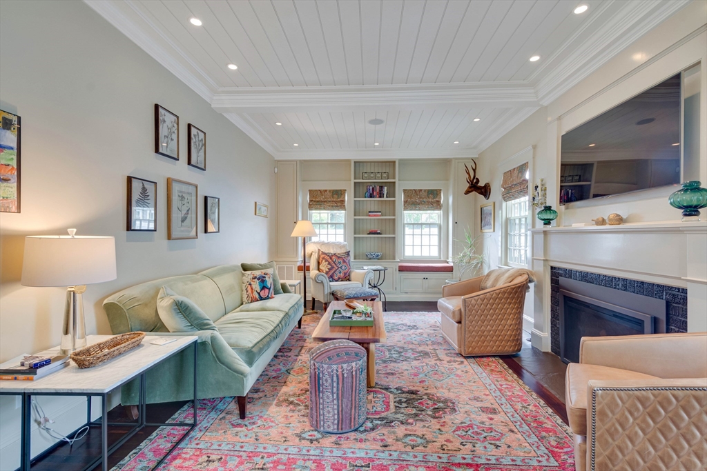24 Cleveland Road Needham, MA 02492 - Photo 16 of 42 a living room with furniture and a fireplace