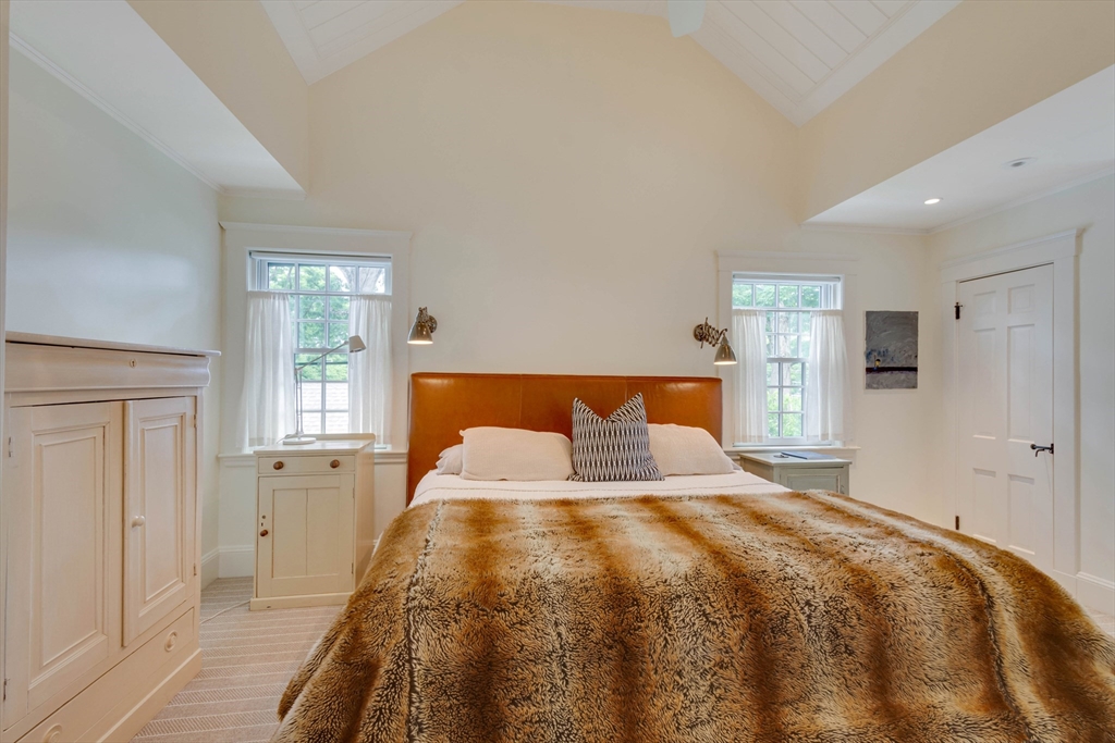 24 Cleveland Road Needham, MA 02492 - Photo 23 of 42 a bedroom with a bed and a window