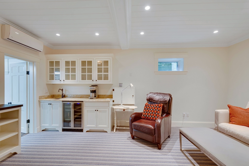 24 Cleveland Road Needham, MA 02492 - Photo 31 of 42 a living room with furniture and a wooden floor
