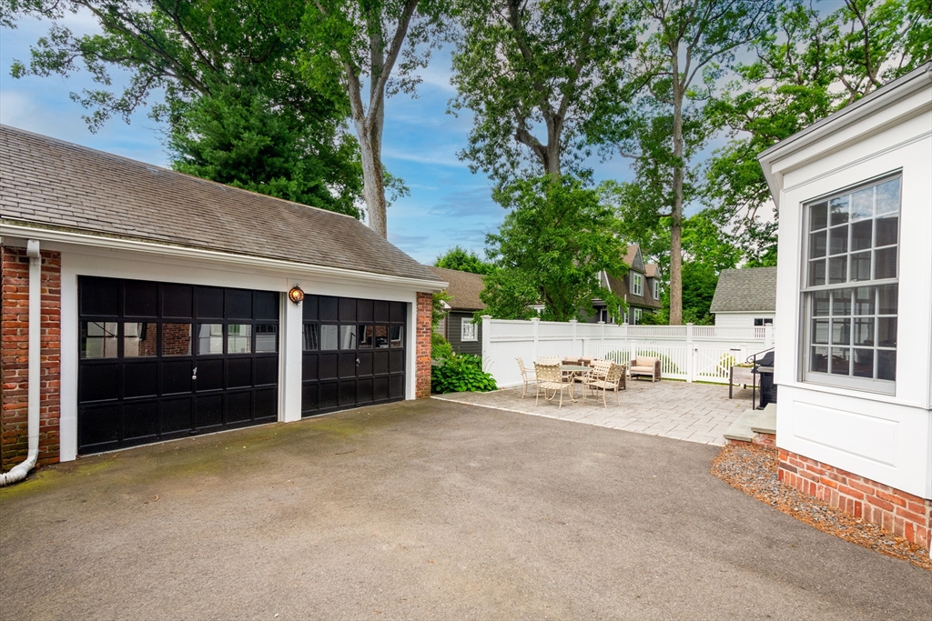 24 Cleveland Road Needham, MA 02492 - Photo 39 of 42 a view of a house with sitting area and garden