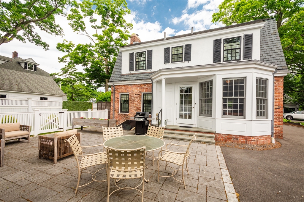 24 Cleveland Road Needham, MA 02492 - Photo 40 of 42 a view of a house with backyard and sitting area
