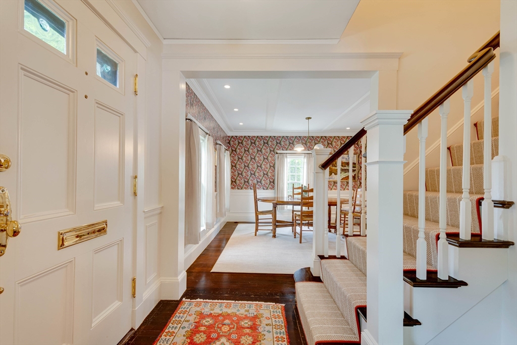 24 Cleveland Road Needham, MA 02492 - Photo 4 of 42 a living room with furniture and a table
