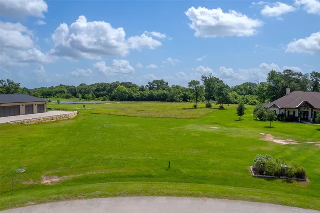 a view of a golf course with a house