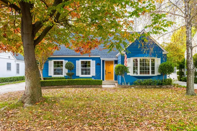 a front view of a house with garden
