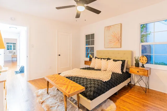 a bedroom with a bed and window