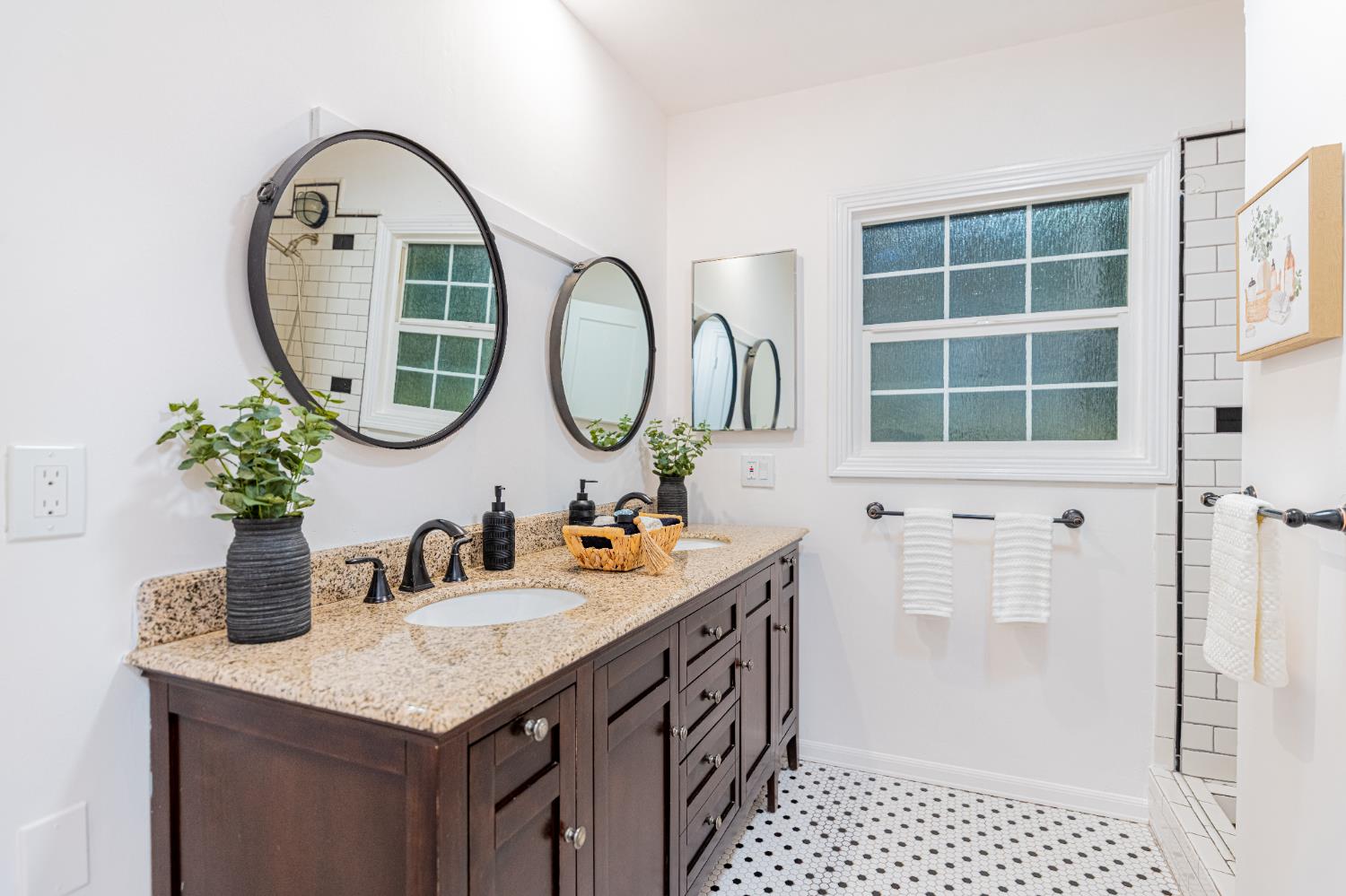 435 Olive Avenue Modesto, CA 95350 - Photo 24 of 29 a bathroom with a sink a mirror and a shower