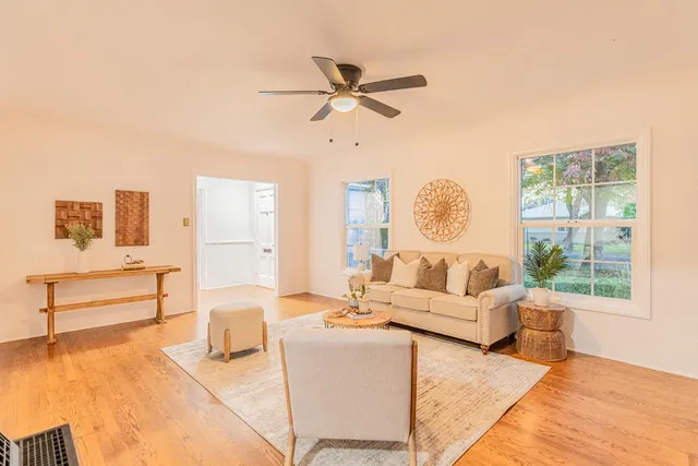 a living room with furniture and a large window