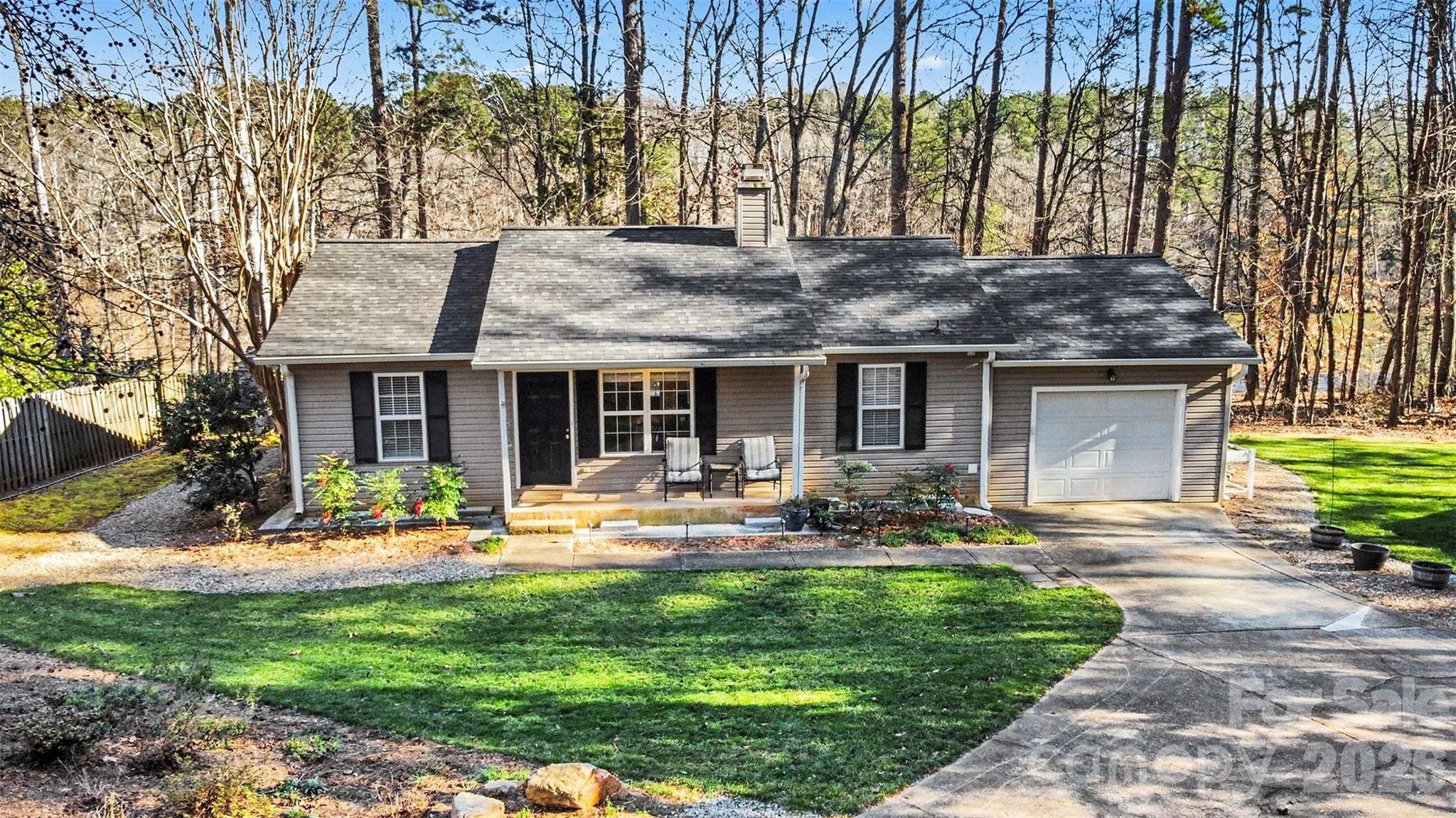 228 Creek View Road Mooresville, NC 28117 - Photo 1 of 40 a front view of house with a garden and patio