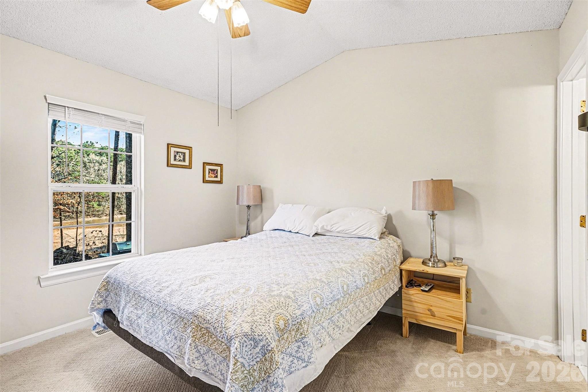 228 Creek View Road Mooresville, NC 28117 - Photo 18 of 40 a bedroom with a bed and a window