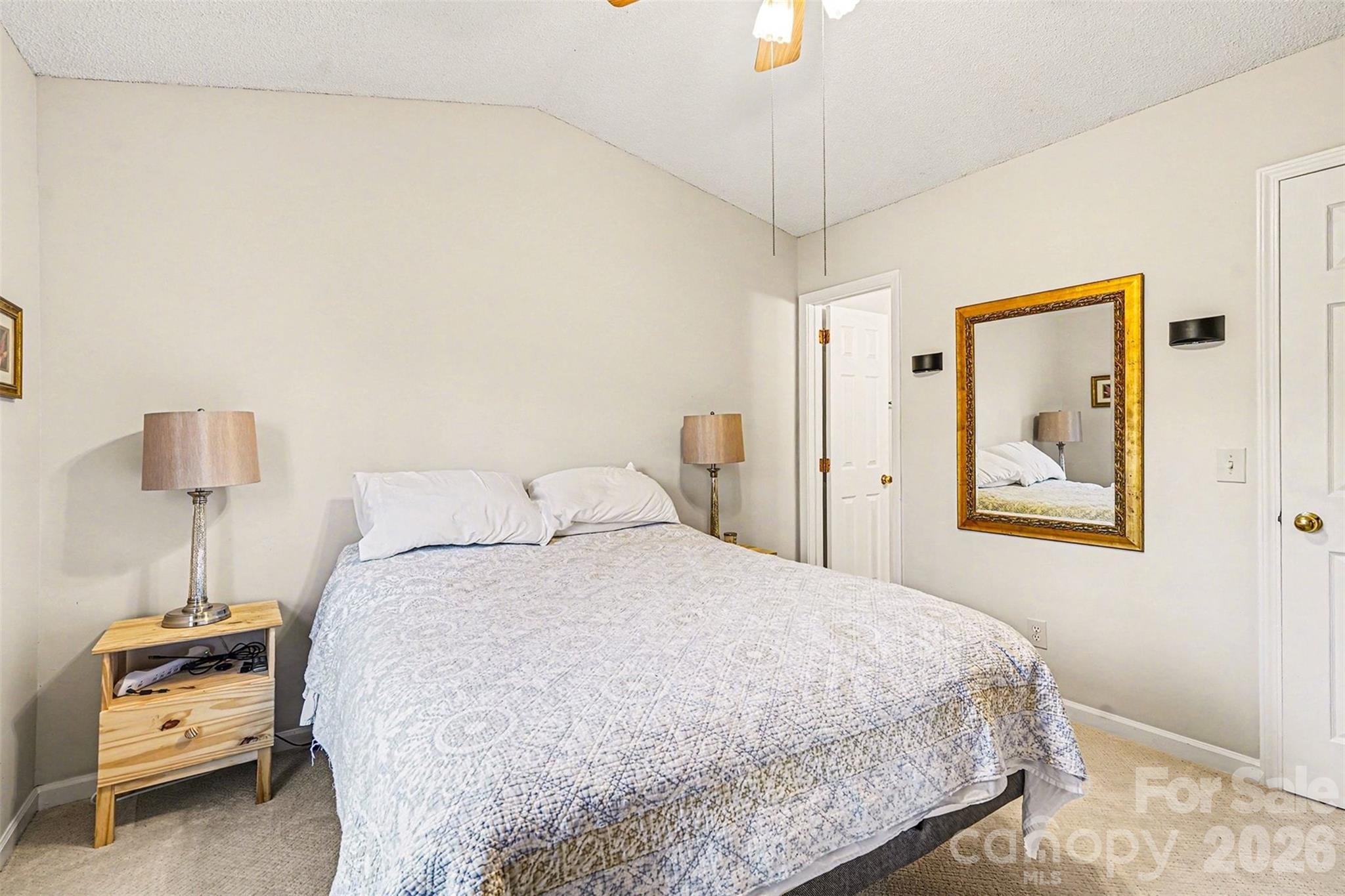228 Creek View Road Mooresville, NC 28117 - Photo 19 of 40 a bedroom with a bed and a lamp