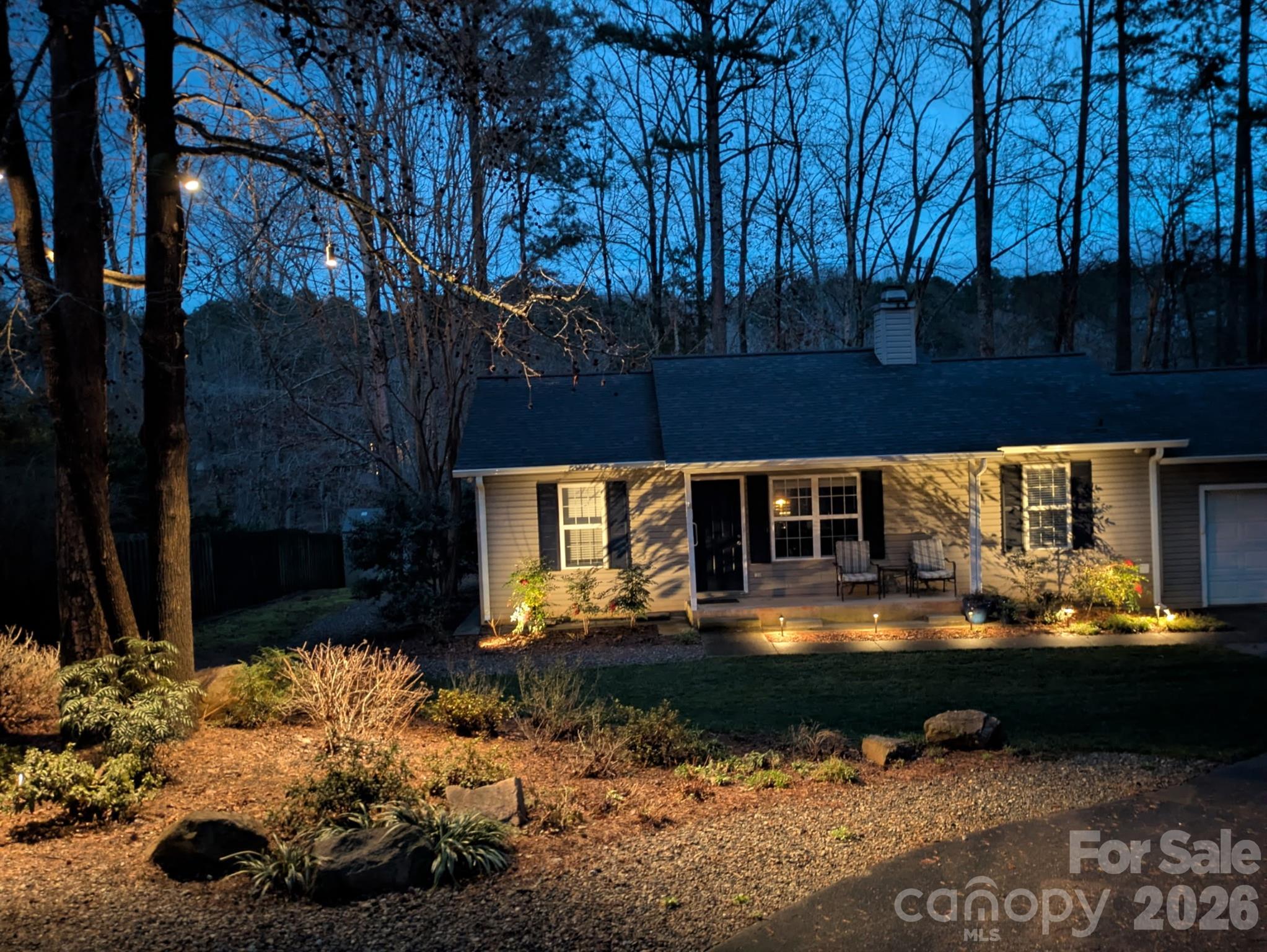 228 Creek View Road Mooresville, NC 28117 - Photo 25 of 40 a front view of a house with yard and trees in the background