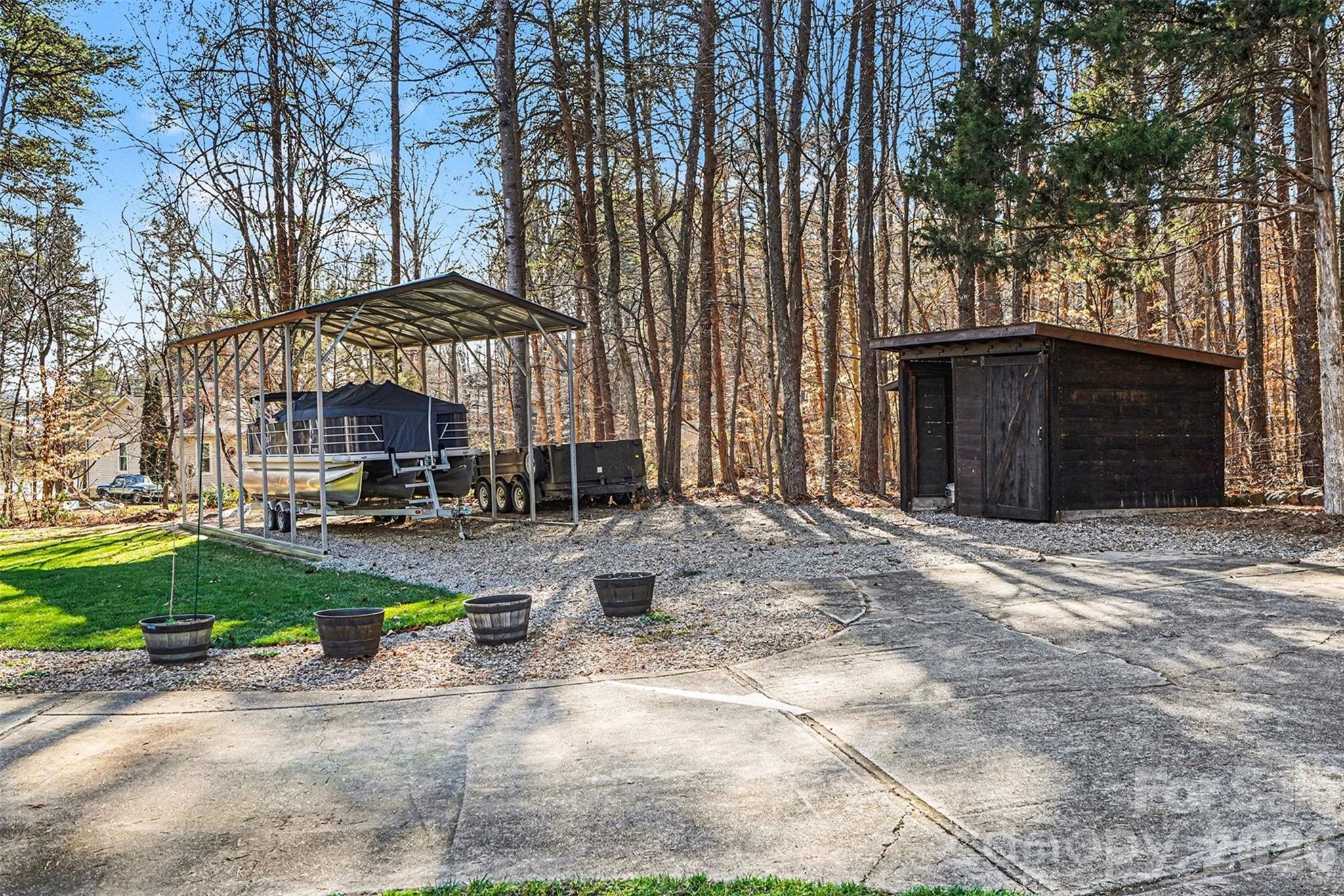 228 Creek View Road Mooresville, NC 28117 - Photo 26 of 40 a view of a backyard with sitting area