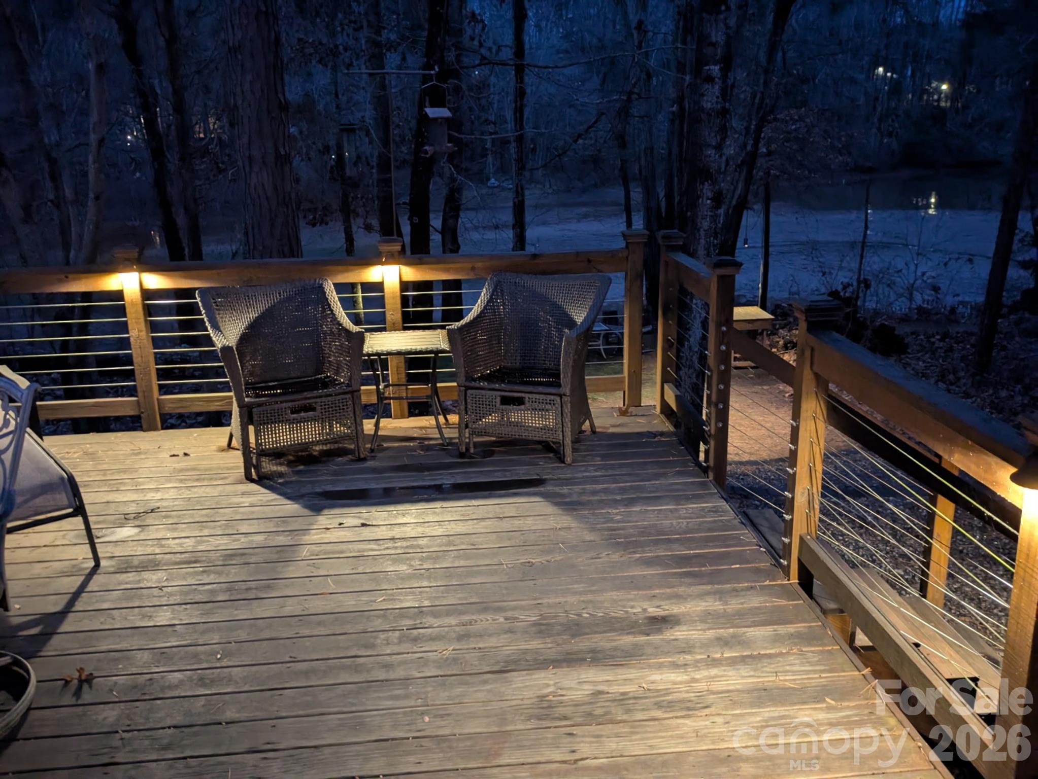 228 Creek View Road Mooresville, NC 28117 - Photo 34 of 40 a view of a patio with table and chairs with wooden floor and fence