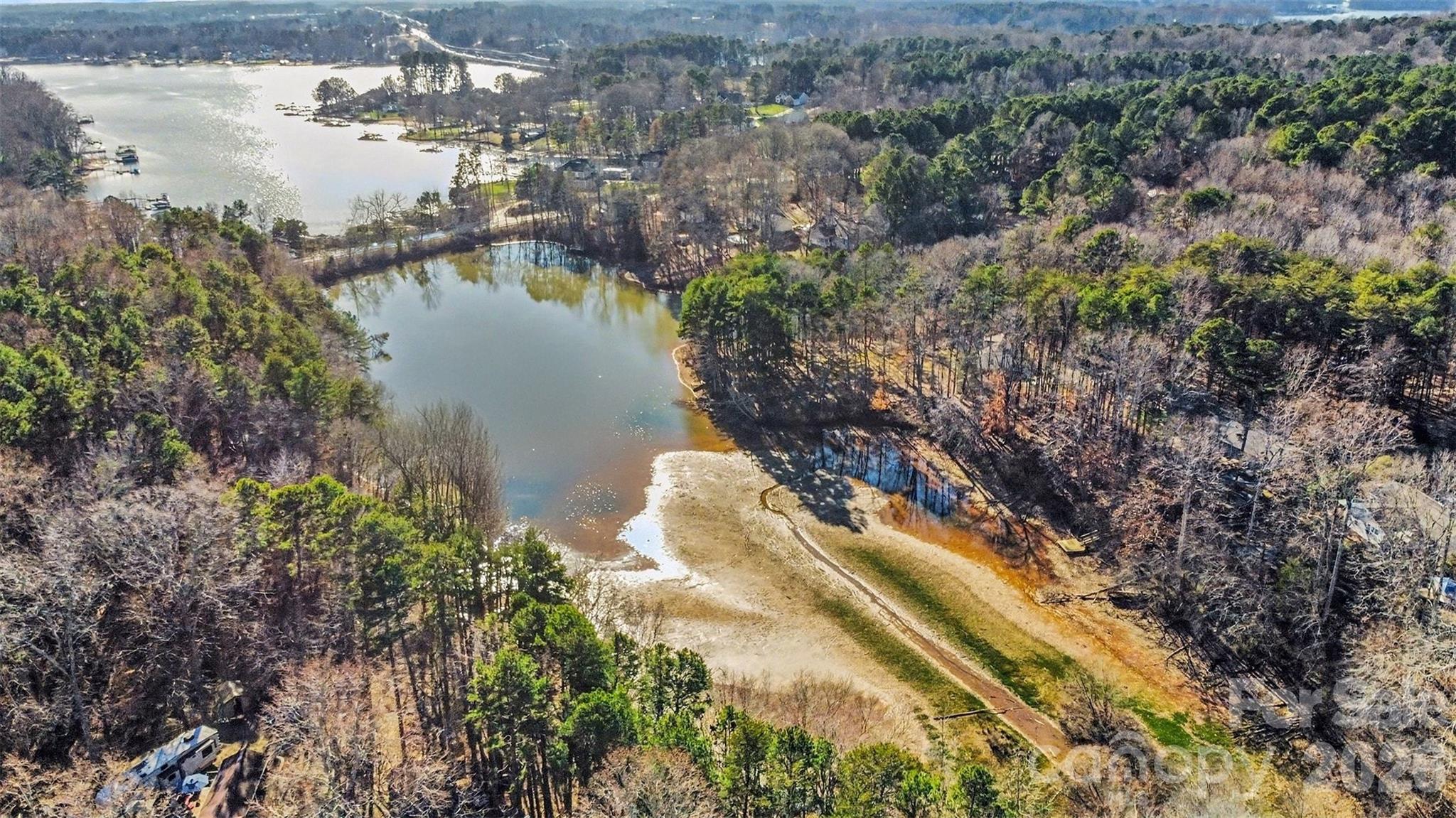 228 Creek View Road Mooresville, NC 28117 - Photo 39 of 40 a view of a lake in middle of forest