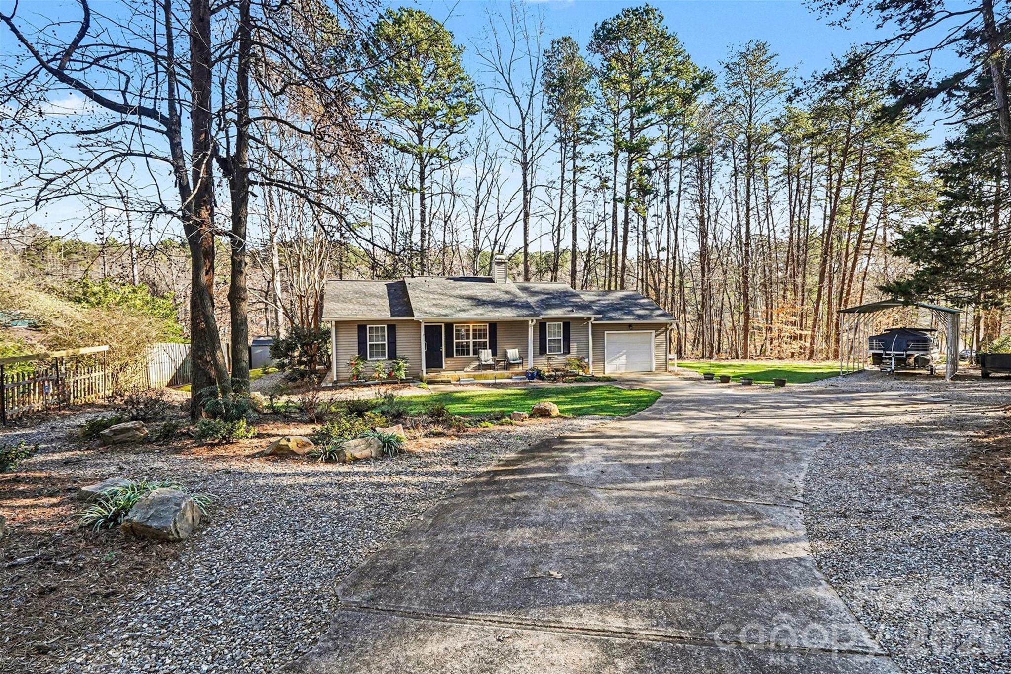 228 Creek View Road Mooresville, NC 28117 - Photo 40 of 40 a front view of a house with a yard and garage