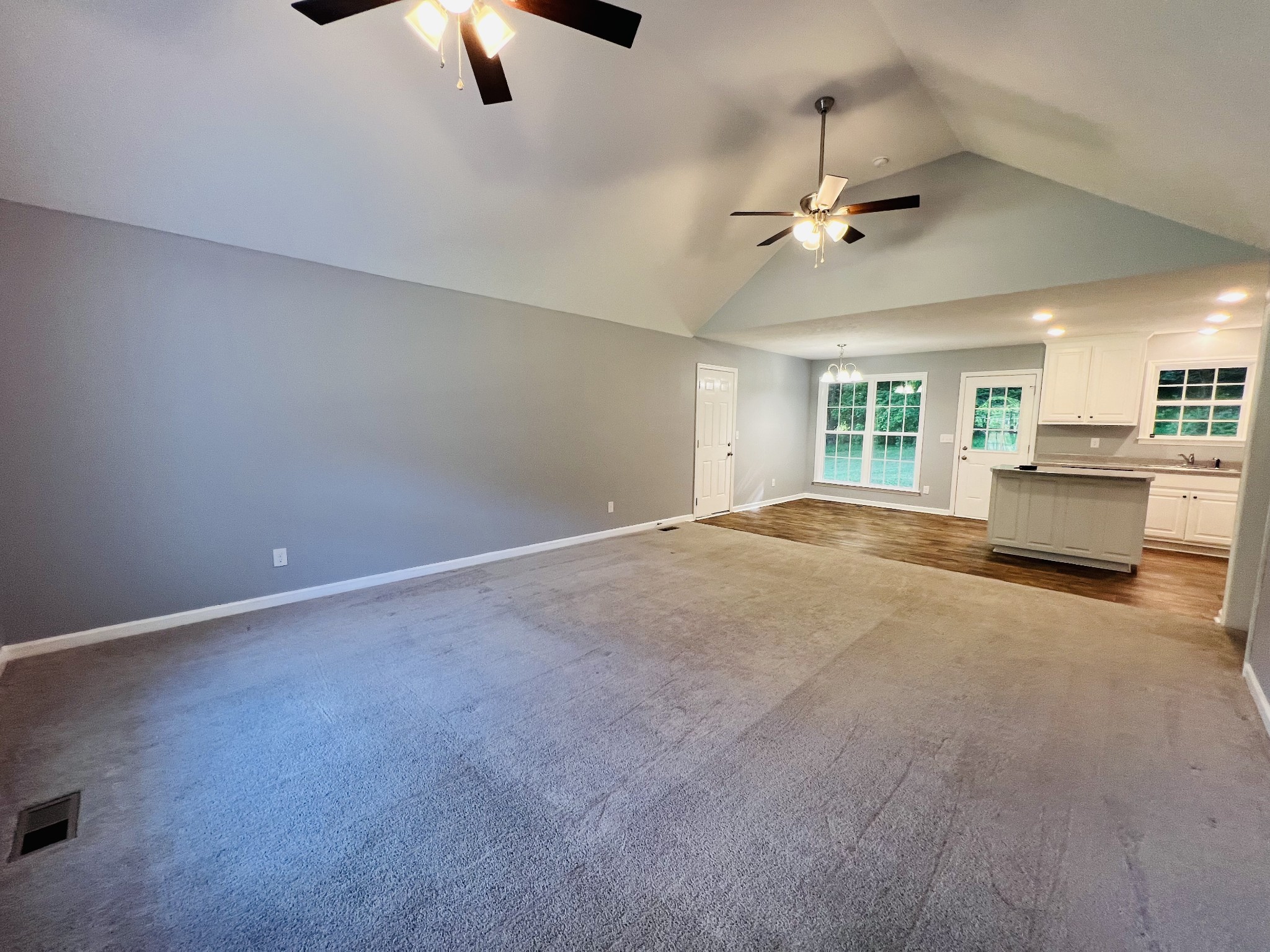 770 Bunker Hill Road Pulaski, TN 38478 - Photo 8 of 26 an empty room with chandelier fan and windows