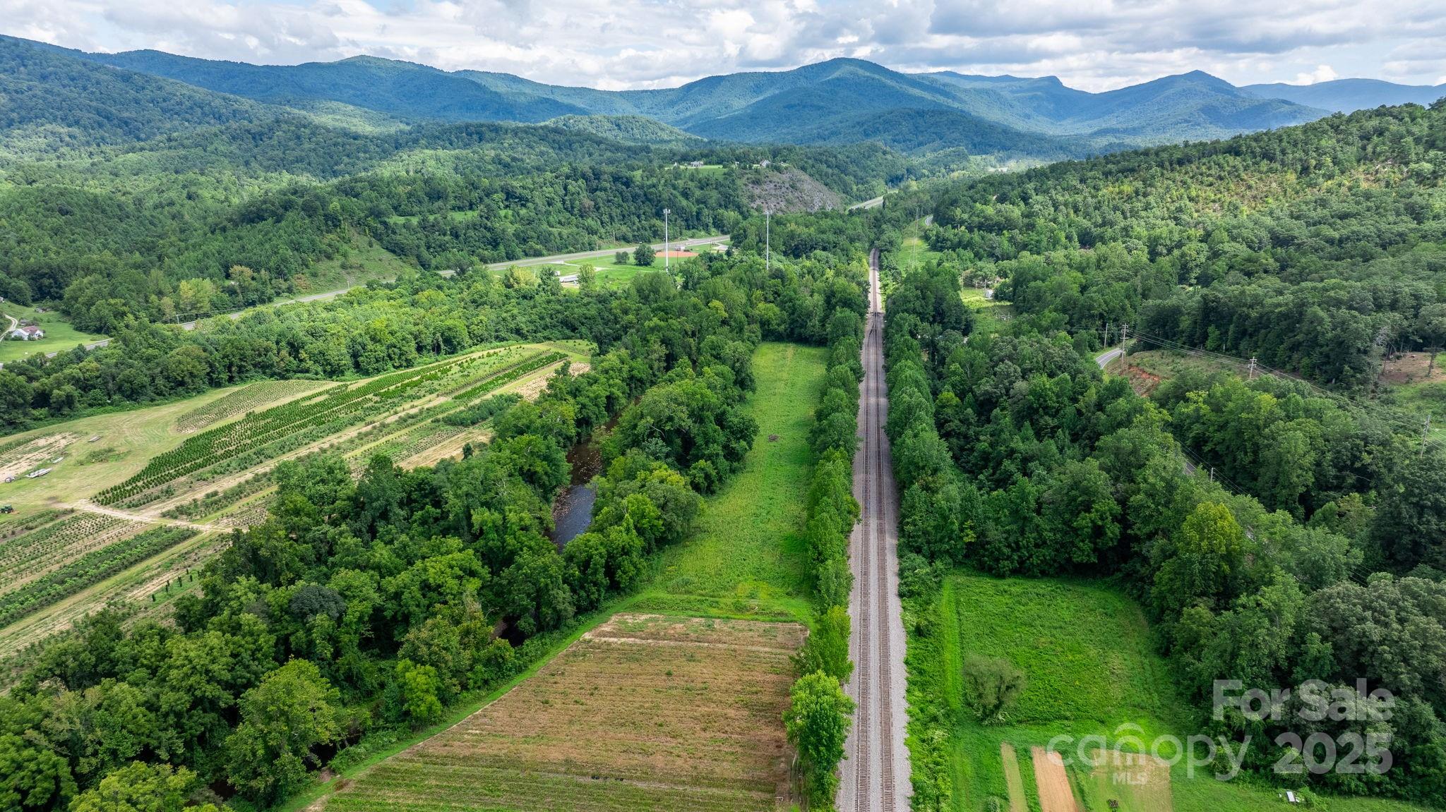 0 Old Linville Road Marion, NC 28752 - Photo 22 of 32 a view of a lush green hillside and a mountain view