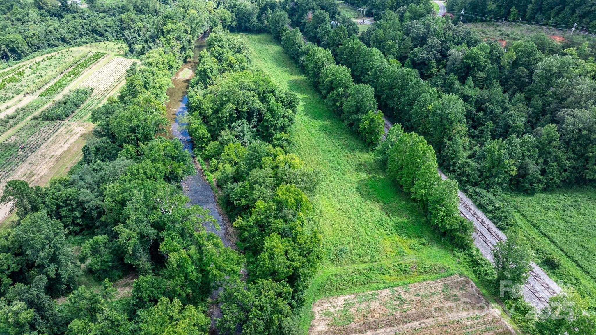 0 Old Linville Road Marion, NC 28752 - Photo 23 of 32 an aerial view of residential houses with outdoor space and trees