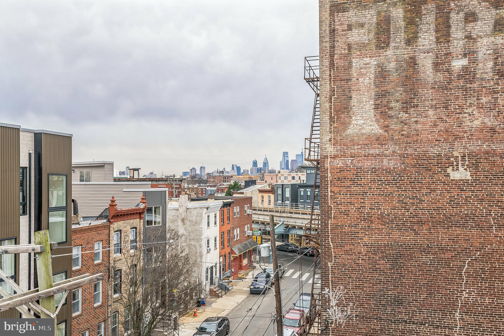 2216 Emerald Street, Unit B Philadelphia, PA 19125 - Photo 22 of 24 a city view with tall buildings