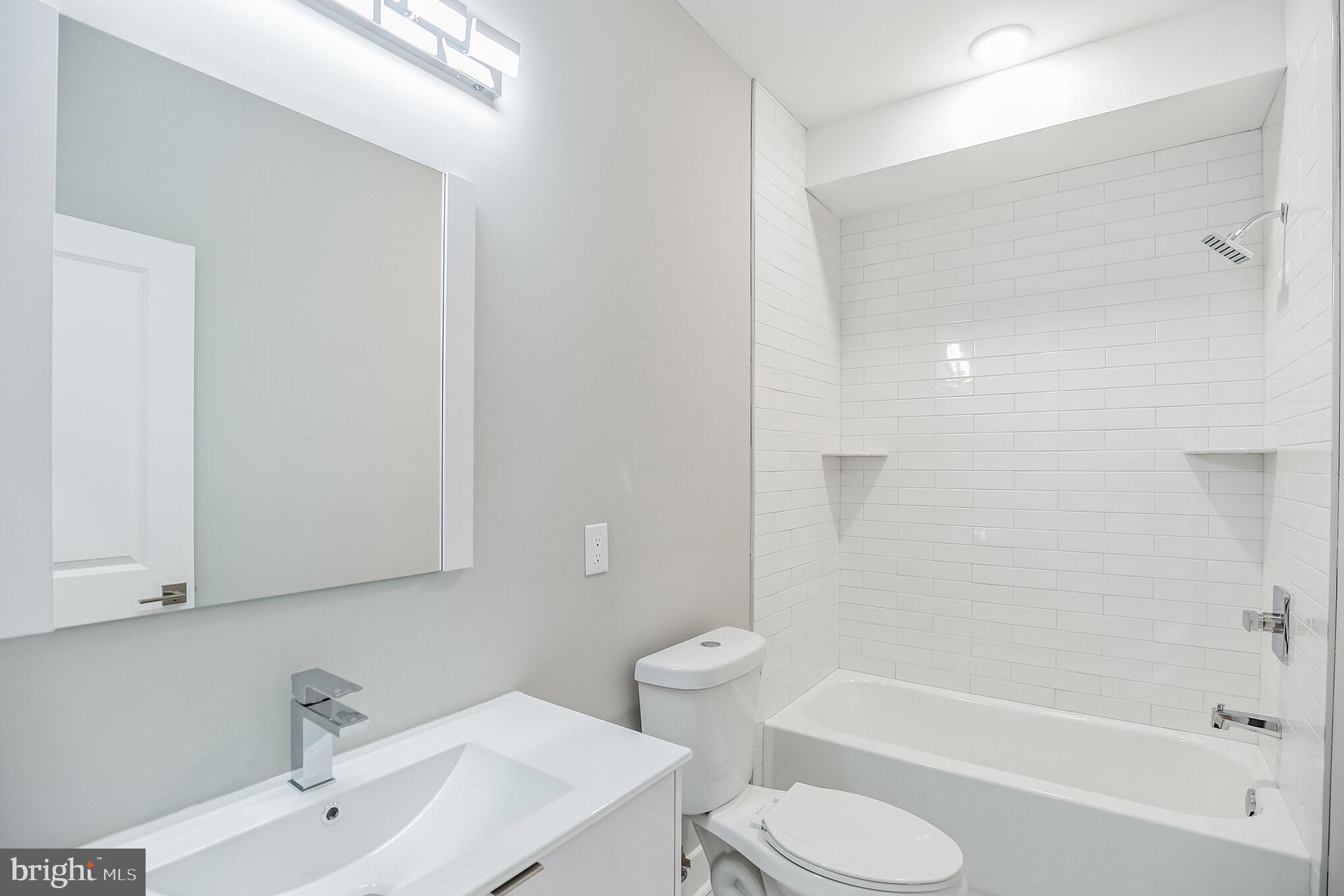 2216 Emerald Street, Unit B Philadelphia, PA 19125 - Photo 5 of 24 a bathroom with a toilet sink and bathtub