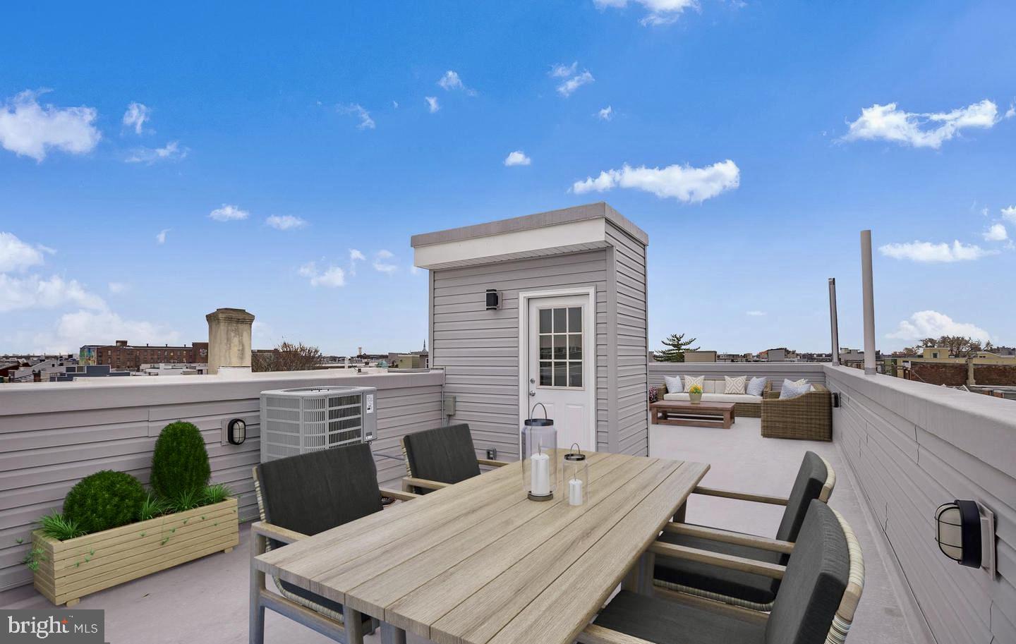 2216 Emerald Street, Unit B Philadelphia, PA 19125 - Photo 10 of 24 a view of a terrace with furniture and a kitchen