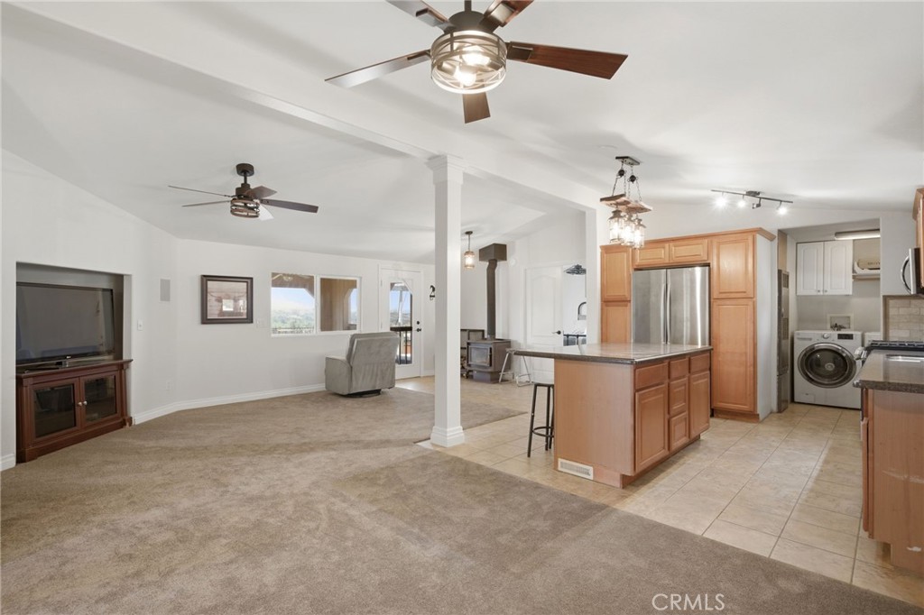 40100 Owl Valley Road Temecula, CA 92592 - Photo 27 of 44 a large room with chandelier fan and windows