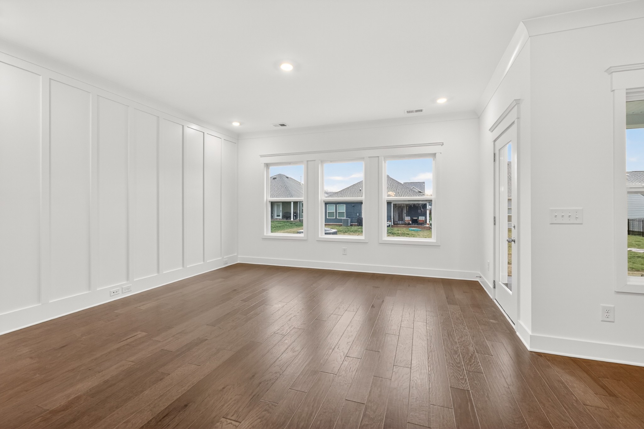 433 Charlie Place White House, TN 37188 - Photo 20 of 30 a view of an empty room with wooden floor and a window
