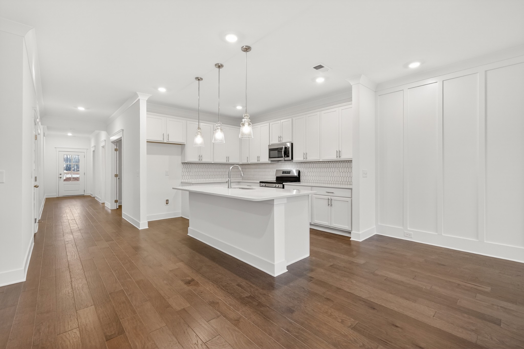 433 Charlie Place White House, TN 37188 - Photo 23 of 30 a kitchen with white cabinets and stainless steel appliances