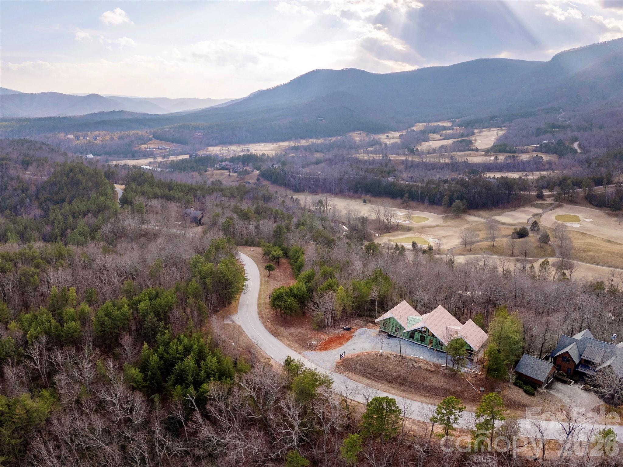 788 Deep Gap Farm Road East Mill Spring, NC 28756 - Photo 13 of 48 a view of a city with mountains in the background