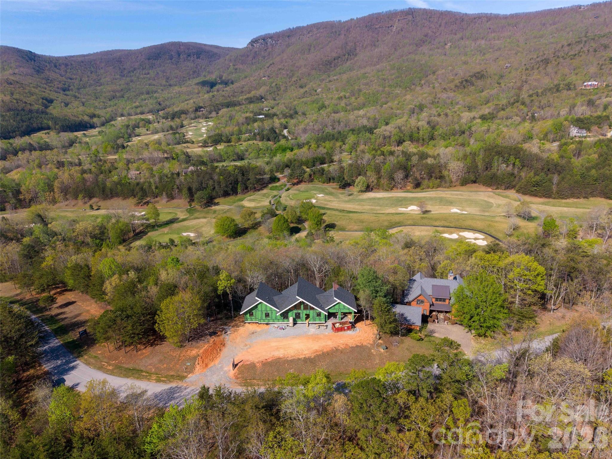 788 Deep Gap Farm Road East Mill Spring, NC 28756 - Photo 2 of 48 an aerial view of mountains residential house and green space