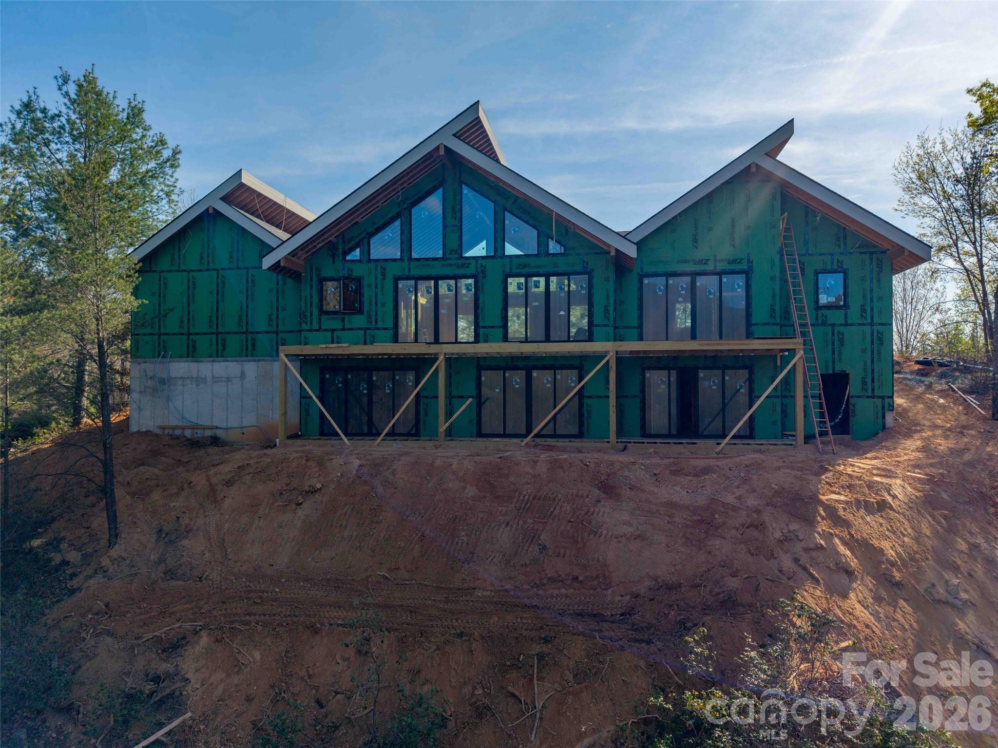 788 Deep Gap Farm Road East Mill Spring, NC 28756 - Photo 42 of 48 a view of a house with wooden fence