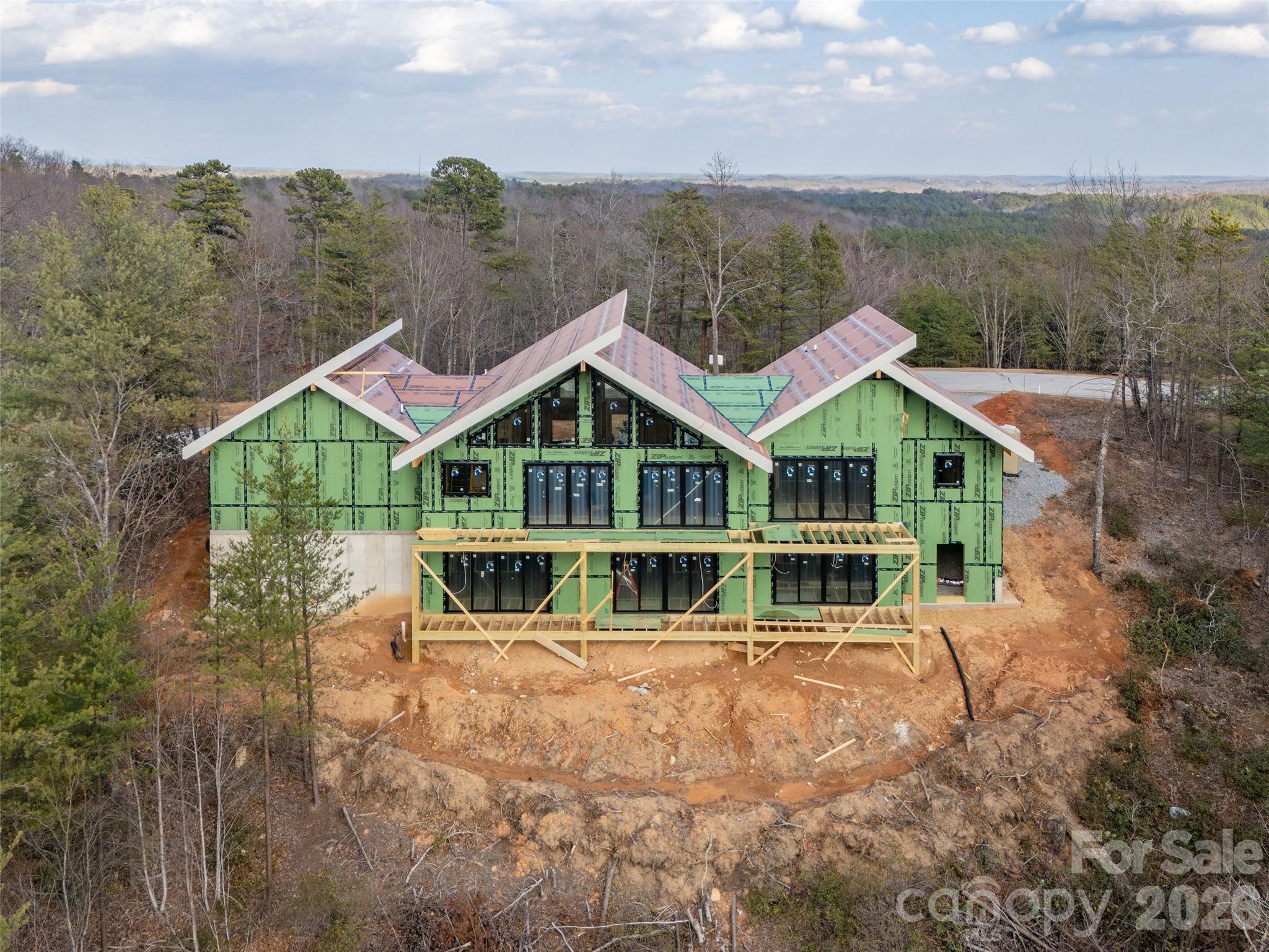 788 Deep Gap Farm Road East Mill Spring, NC 28756 - Photo 7 of 48 a view of house with yard and ocean view