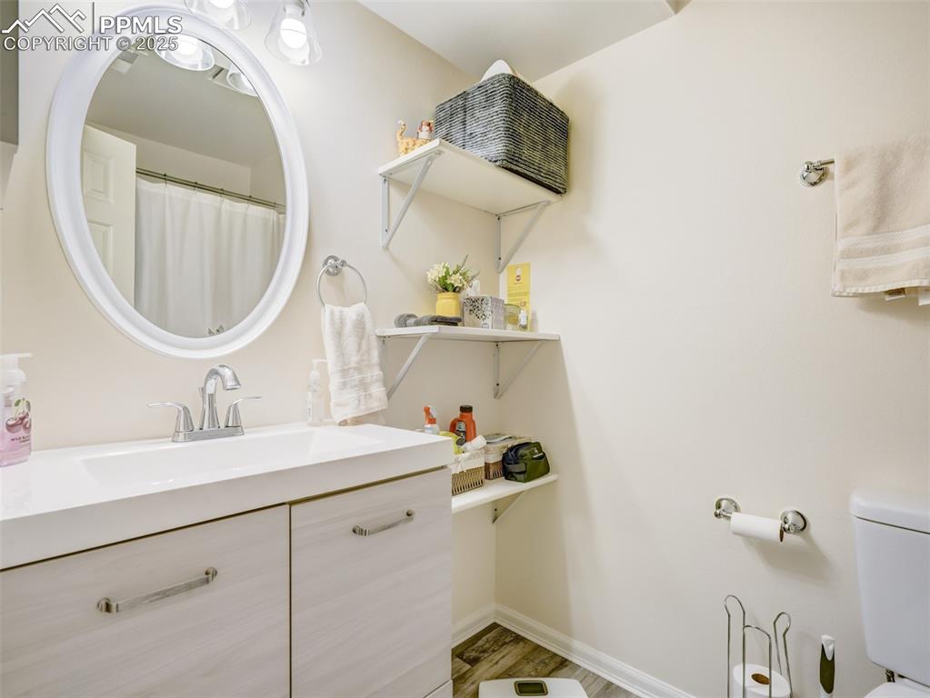 842 Tenderfoot Hill Road, Unit 1 Colorado Springs, CO 80906 - Photo 36 of 41 a bathroom with a sink and a mirror