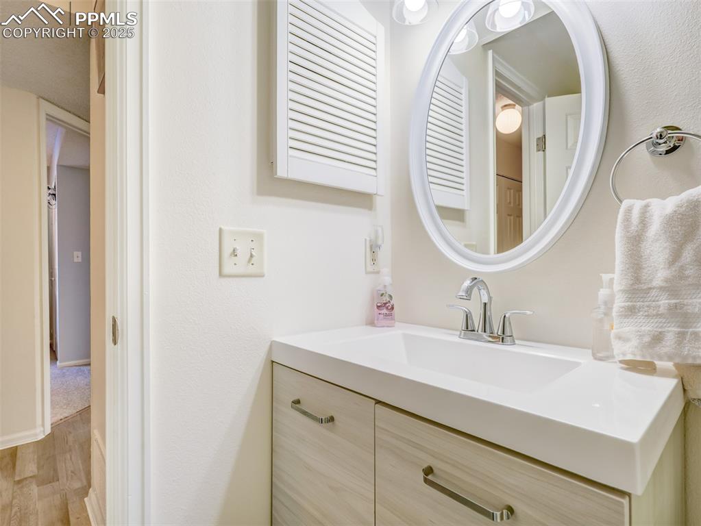842 Tenderfoot Hill Road, Unit 1 Colorado Springs, CO 80906 - Photo 37 of 41 a bathroom with a sink and a mirror
