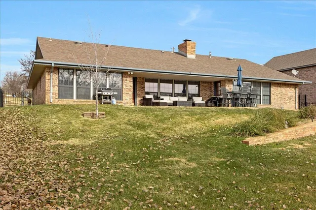 a house view with a sitting space and garden view