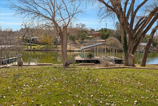 a view of a lake with houses on both side