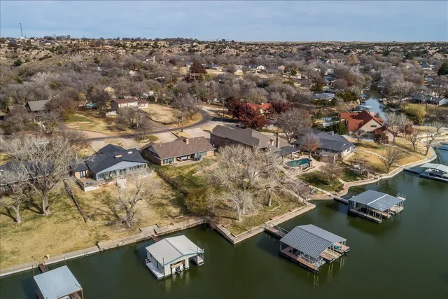 an aerial view of residential houses with outdoor space