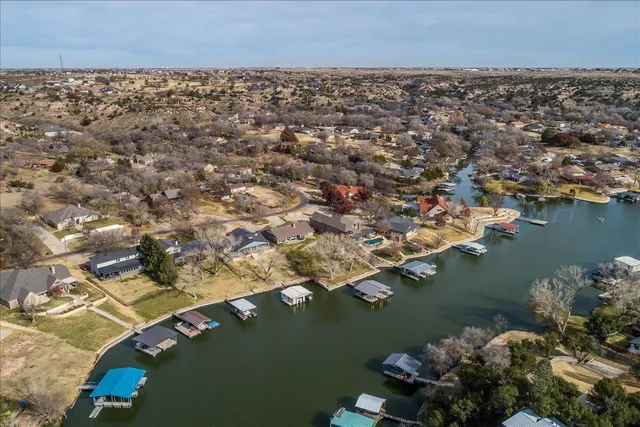 an aerial view of a houses with ocean view