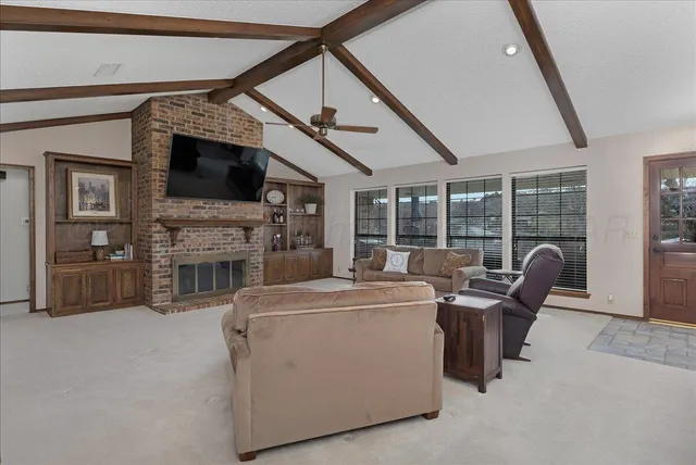a view of livingroom with furniture and flat screen tv