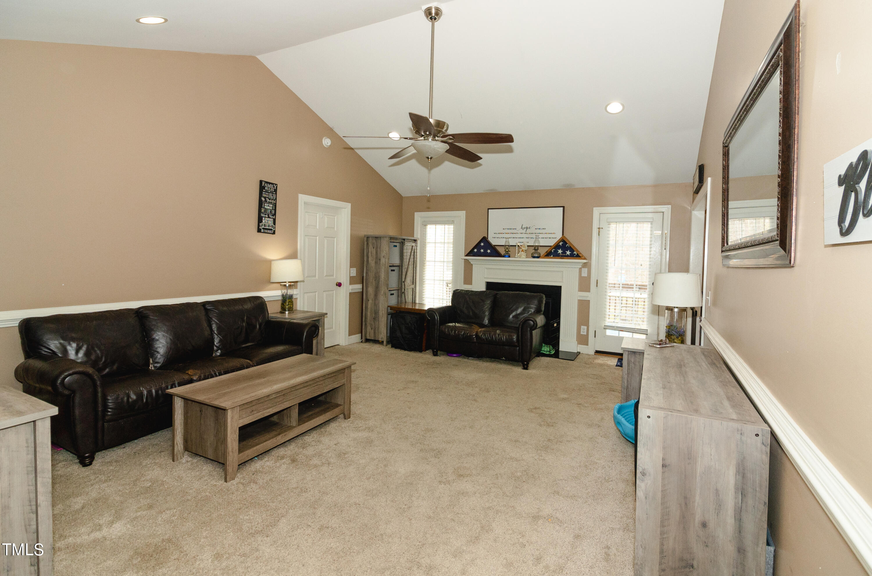 102 Younger Road Roxboro, NC 27573 - Photo 14 of 23 a living room with furniture and a fireplace