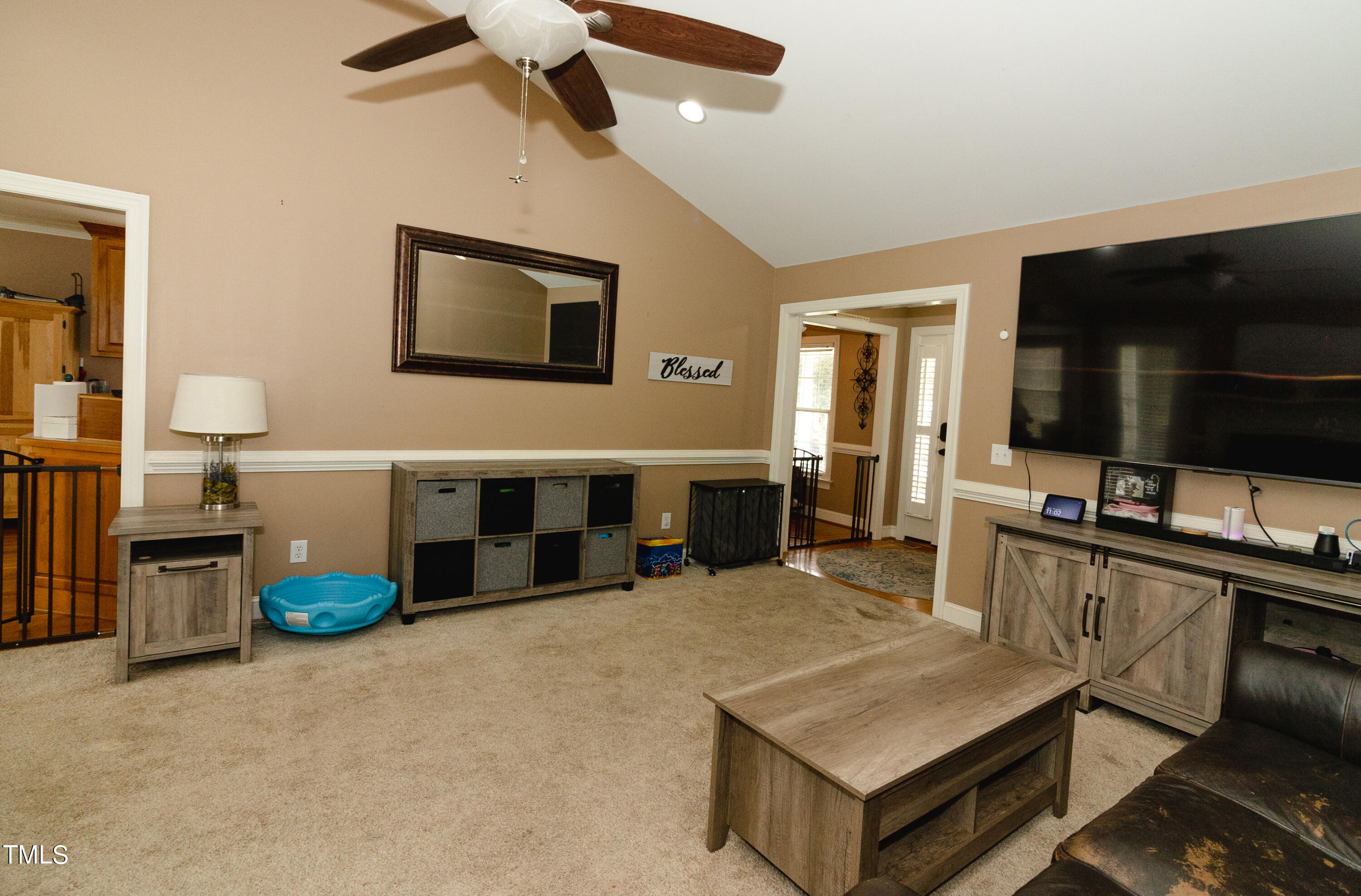 102 Younger Road Roxboro, NC 27573 - Photo 17 of 23 a living room with furniture and a flat screen tv