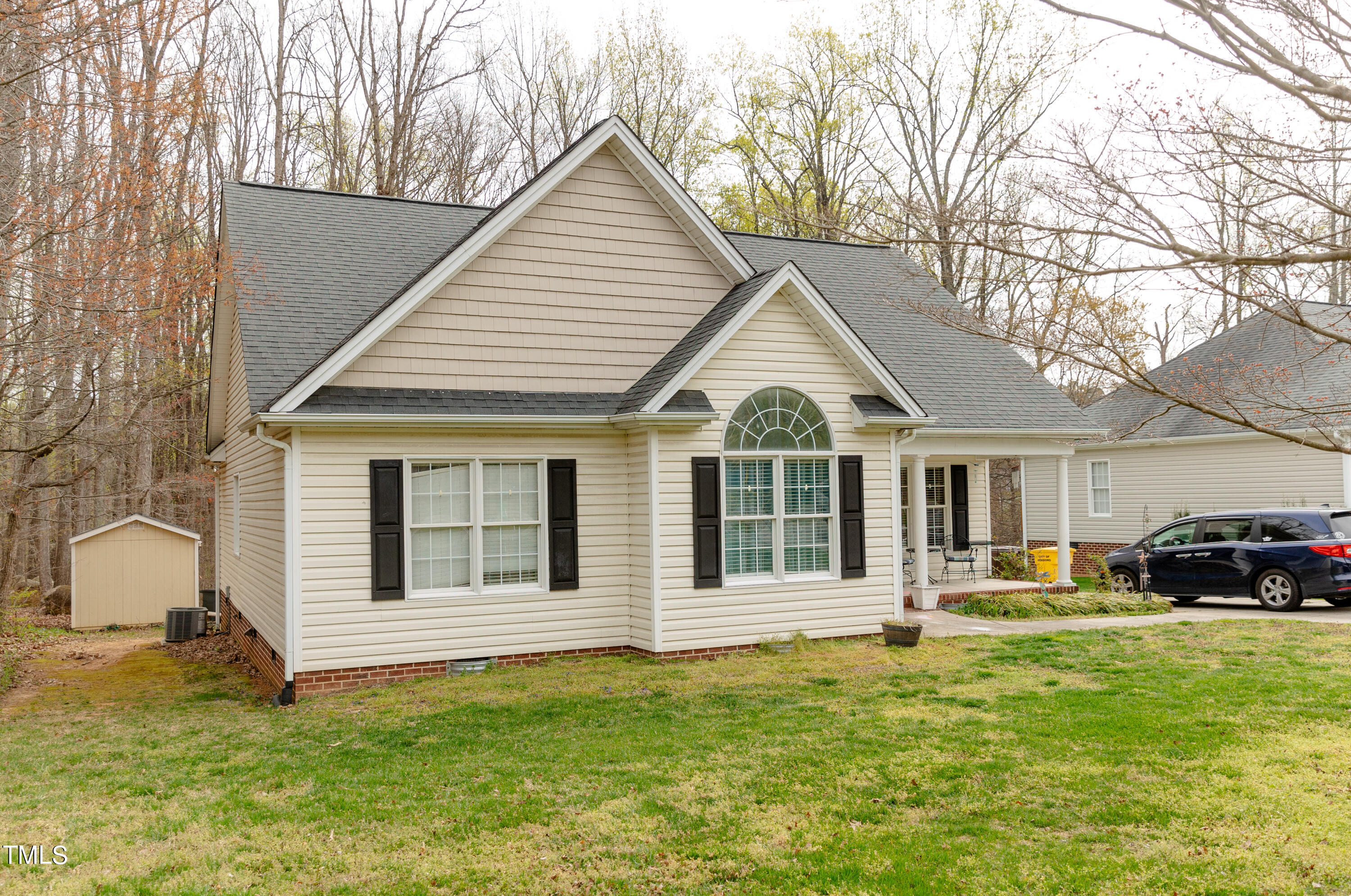 102 Younger Road Roxboro, NC 27573 - Photo 19 of 23 a front view of a house with a yard
