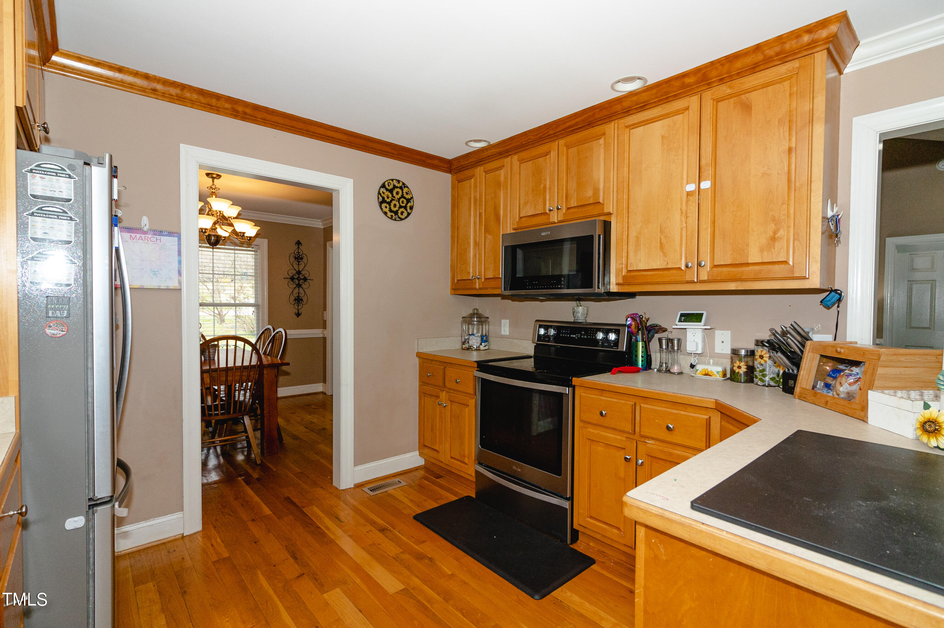 102 Younger Road Roxboro, NC 27573 - Photo 3 of 23 a kitchen with stainless steel appliances granite countertop a refrigerator stove top oven and sink