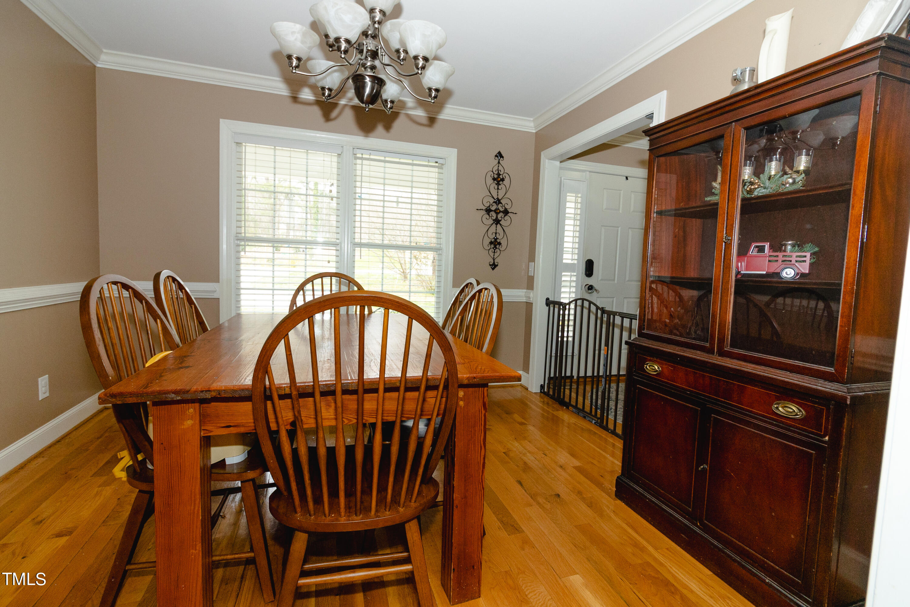 102 Younger Road Roxboro, NC 27573 - Photo 5 of 23 a view of a dining room with furniture window and wooden floor