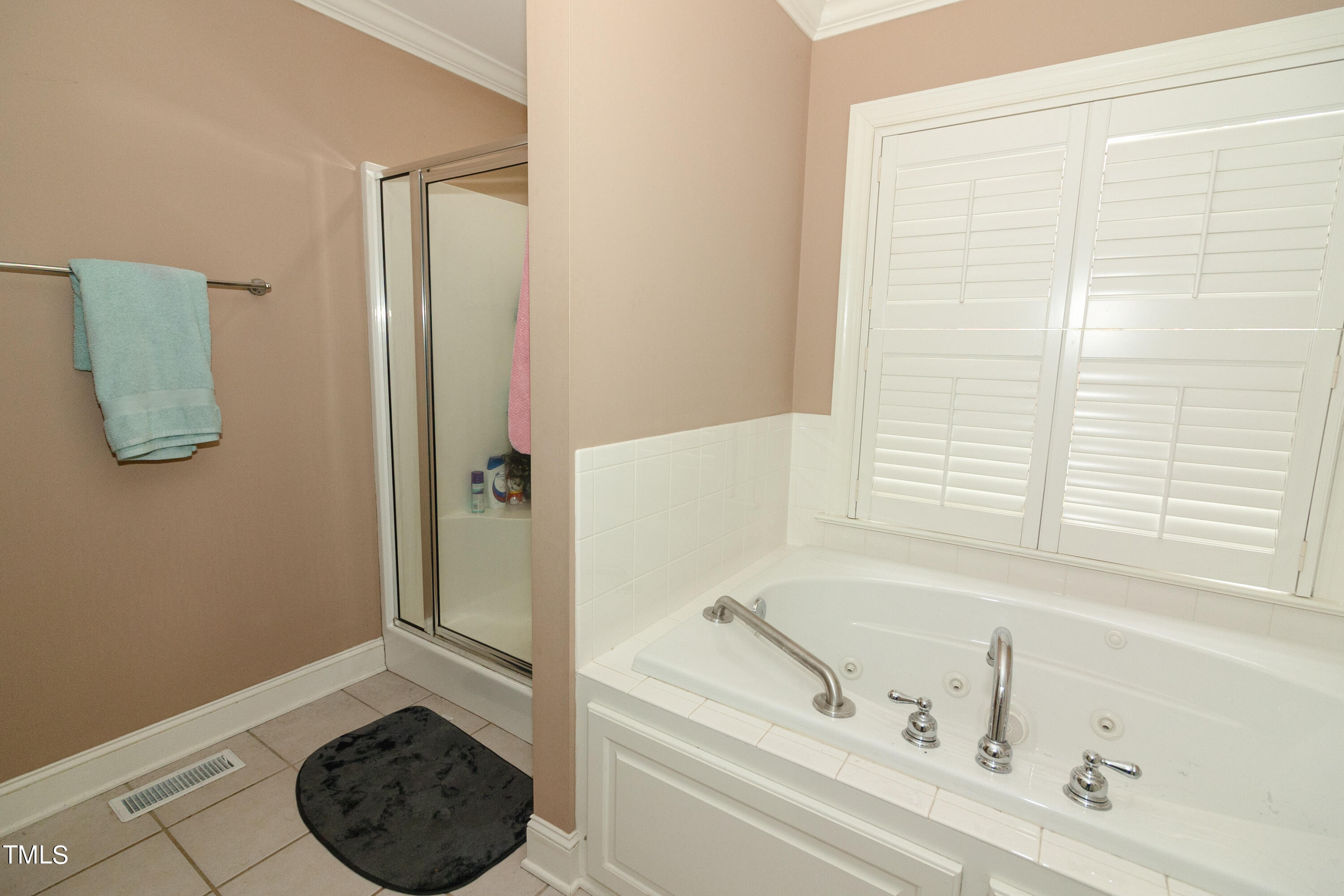 102 Younger Road Roxboro, NC 27573 - Photo 9 of 23 a bathroom with a tub and a window